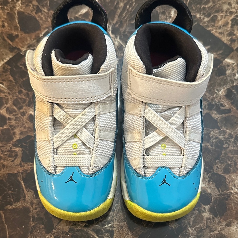 Kids Jordan’s Blue and Yellow Sneakers
